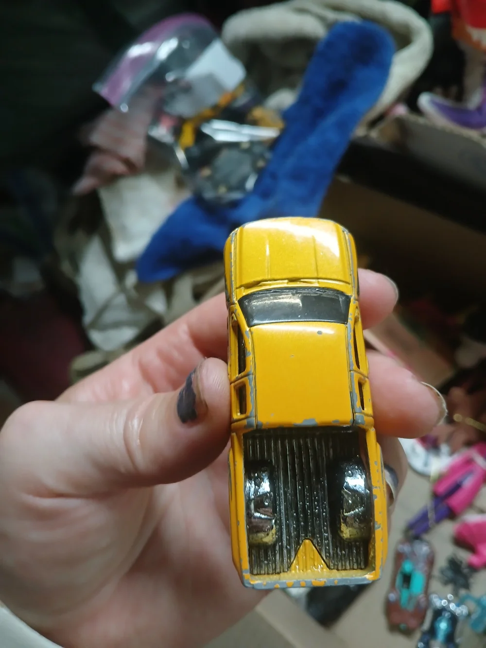 yellow 1:64 scale Hot Wheels Chevy Silverado,